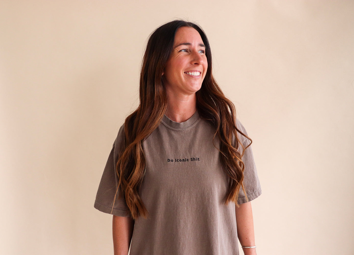Do iconic shit brown shirt against plain cream background