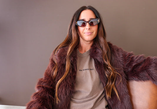 Do Iconic Shit embroidered shirt styled with fur and sunglasses
