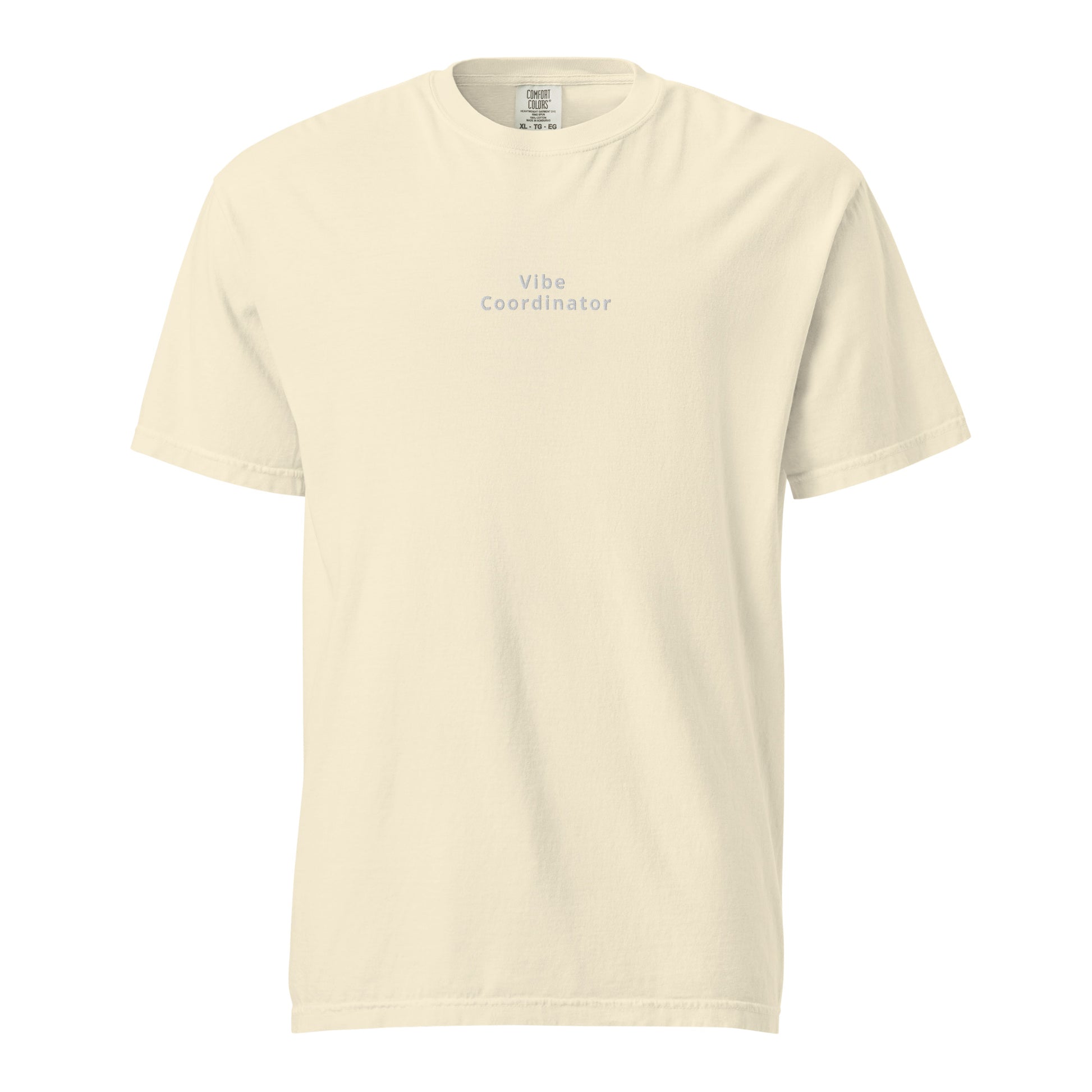Product mockup with ivory shirt and white words saying vibe coordinator on white background
